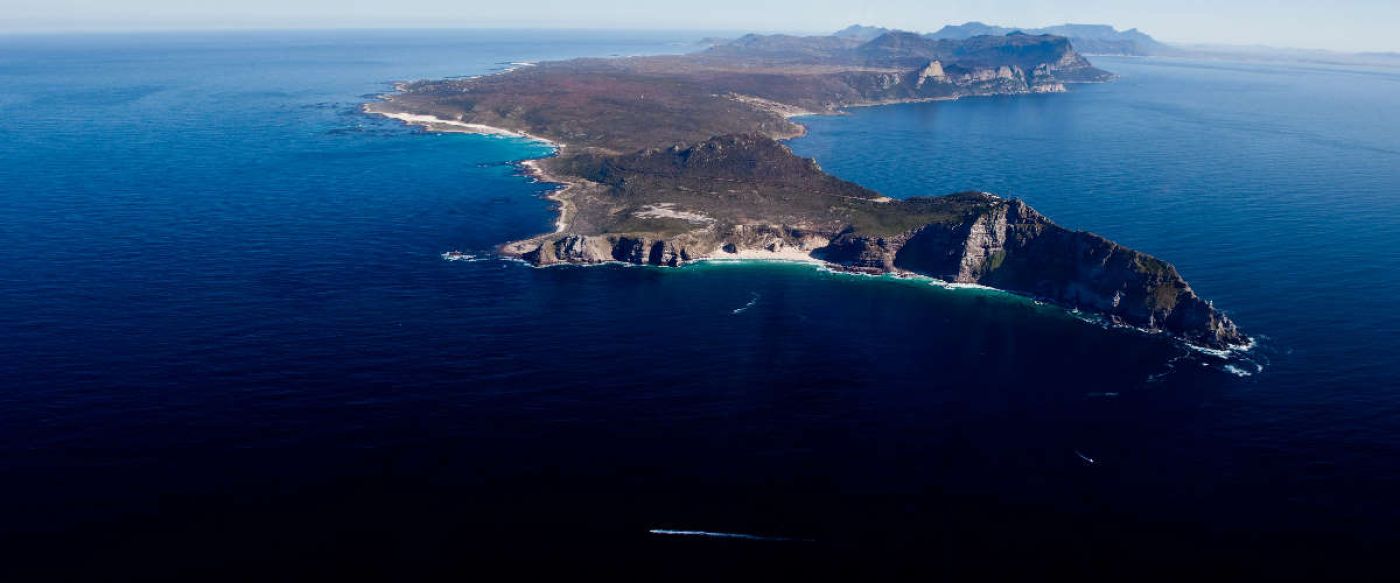 Cape Point Reserve stretching into a blue ocean surrounding it
