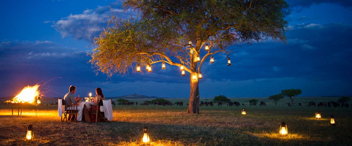 romantic lantern lit outdoor camp fire dinner for two at Singita Sanbora Lodge
